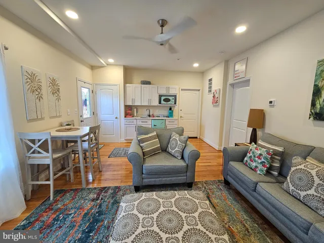 a living room with furniture and a rug