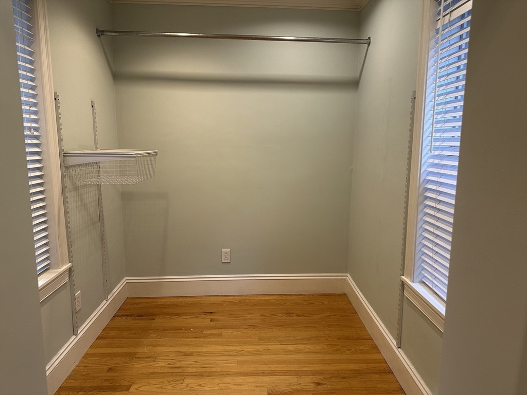 1 Hull St Court, Unit 4 Boston, MA 02113 - Photo 5 of 10 a view of a room with wooden floor and small window