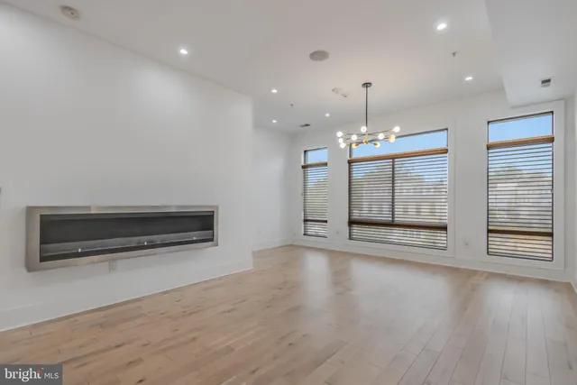 a view of a kitchen with a sink and a refrigerator
