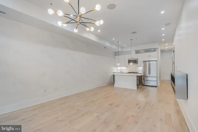 a view of a hallway with washer and dryer