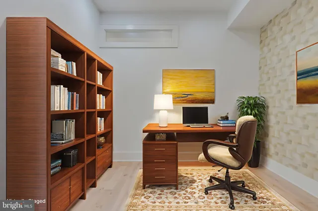 a work room with furniture bookshelf and a bookshelf