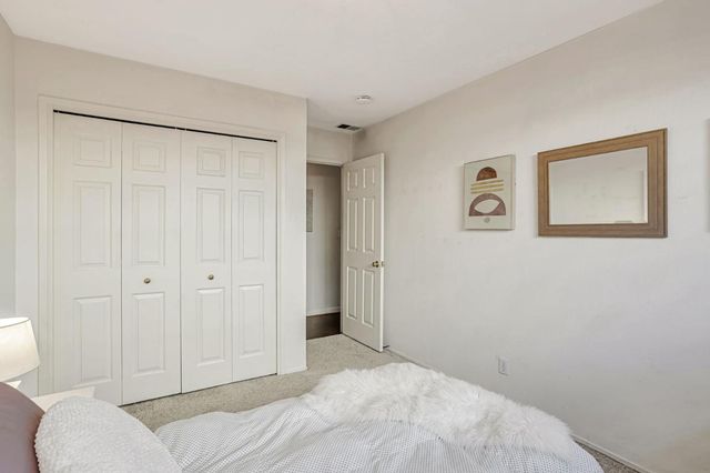 a bedroom with a bed and a shower