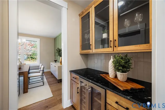 a kitchen with a stove and a window