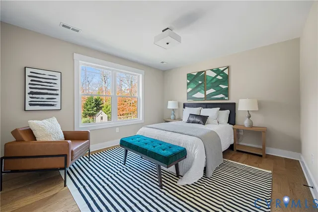 a bedroom with a bed and a couch