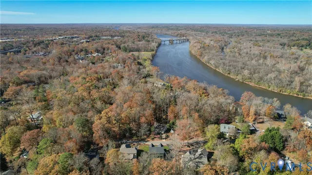 an aerial view of house with yard