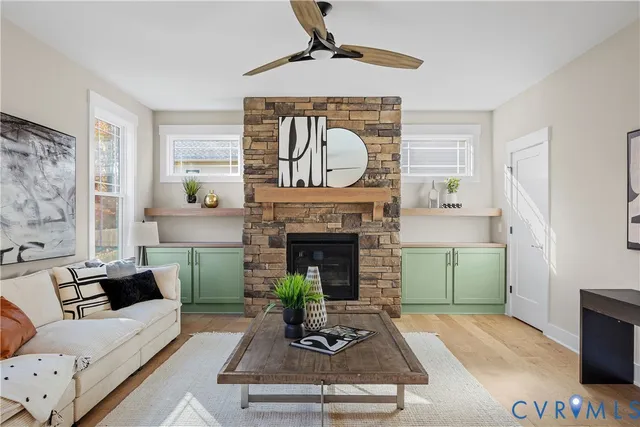 a living room with furniture and a fireplace