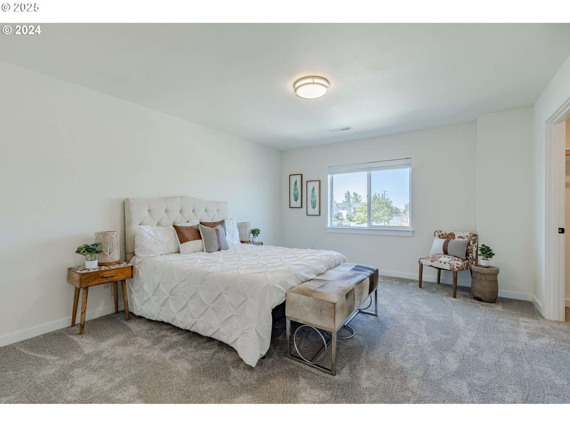 741 Periander Way Harrisburg, OR 97446 - Photo 12 of 24 a bedroom with a bed and a window