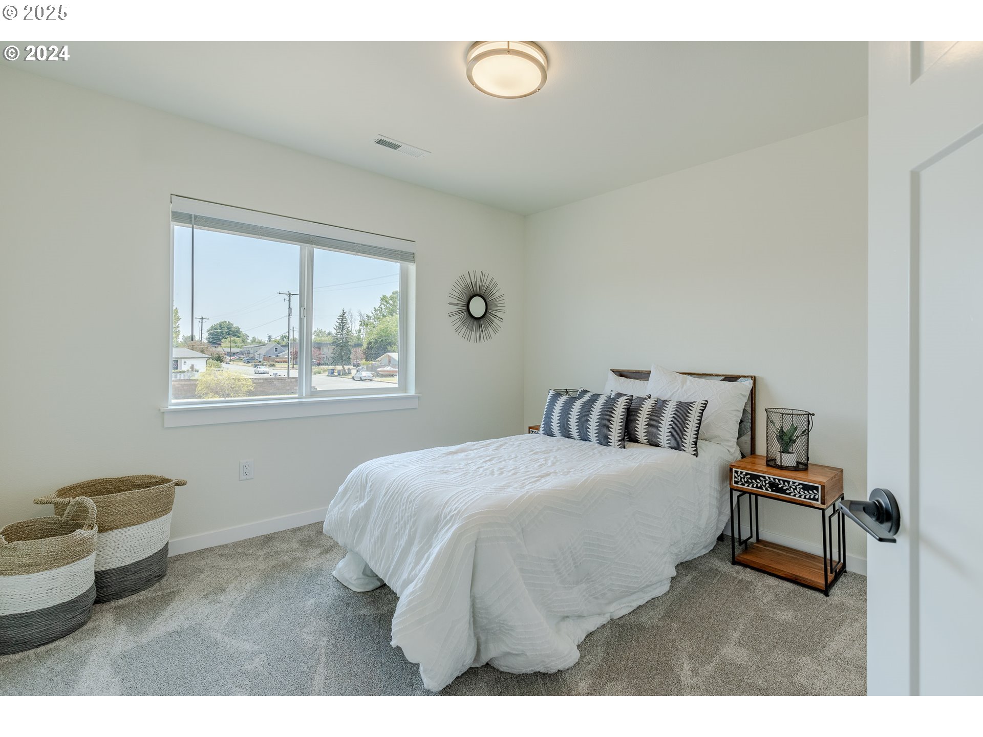741 Periander Way Harrisburg, OR 97446 - Photo 16 of 24 a bedroom with a bed and window