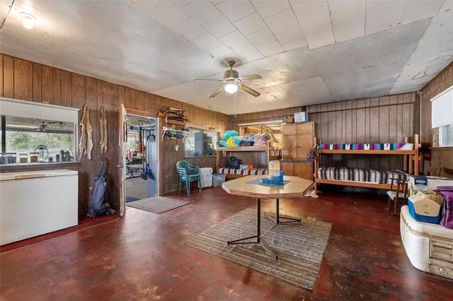 a room with lots of furniture and wooden floor