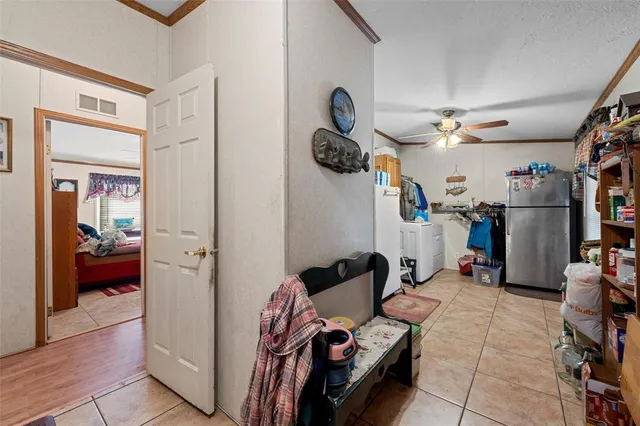 a view of a livingroom with furniture and closet