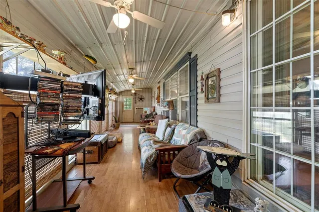 a view of entryway livingroom and hall with wooden floor