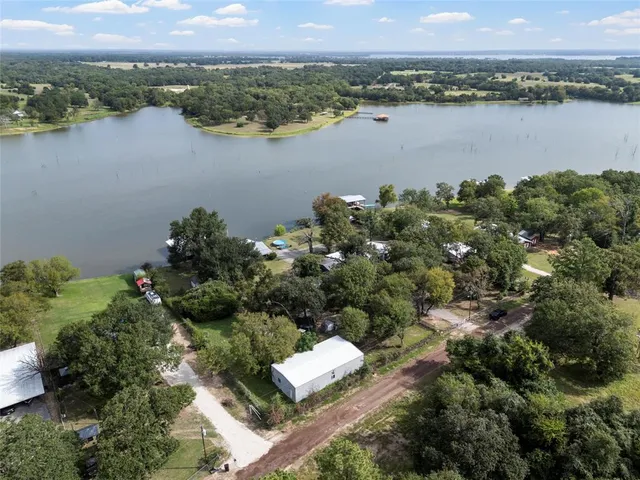 an aerial view of a city and lake view