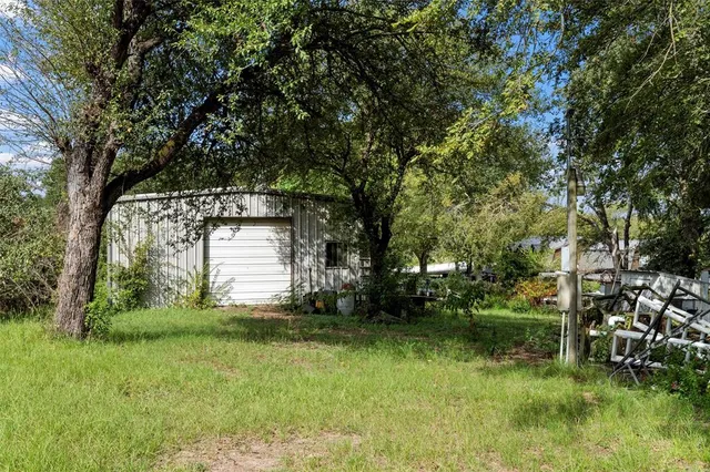 a backyard of a house with lots of green space