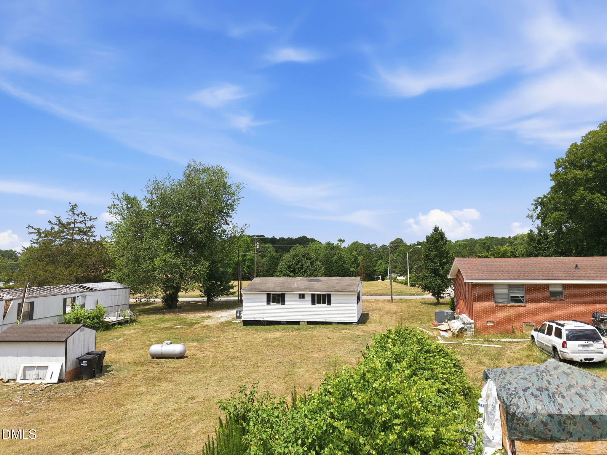 1758 Barber Mill Road Clayton, NC 27520 - Photo 22 of 41 a view of a swimming pool with a patio and a yard