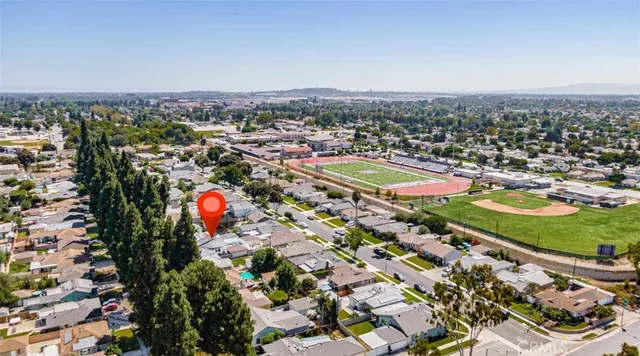 an aerial view of residential houses with outdoor space