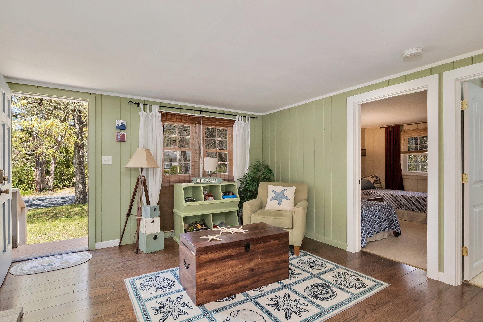 28 Swan Lake Road West Yarmouth, MA 02673 - Photo 21 of 44 a living room with furniture and a window