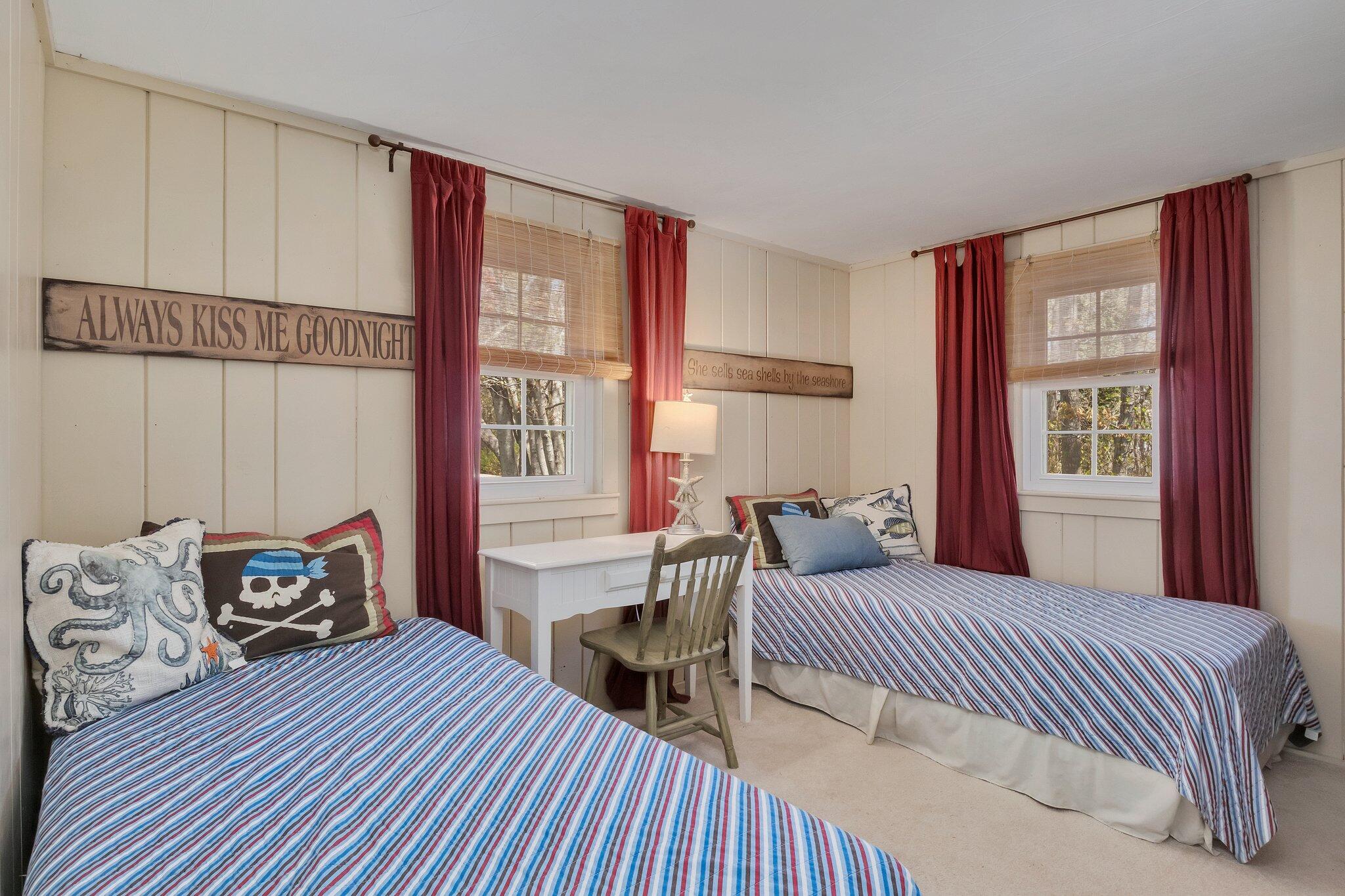 28 Swan Lake Road West Yarmouth, MA 02673 - Photo 26 of 44 a bedroom with furniture and a window