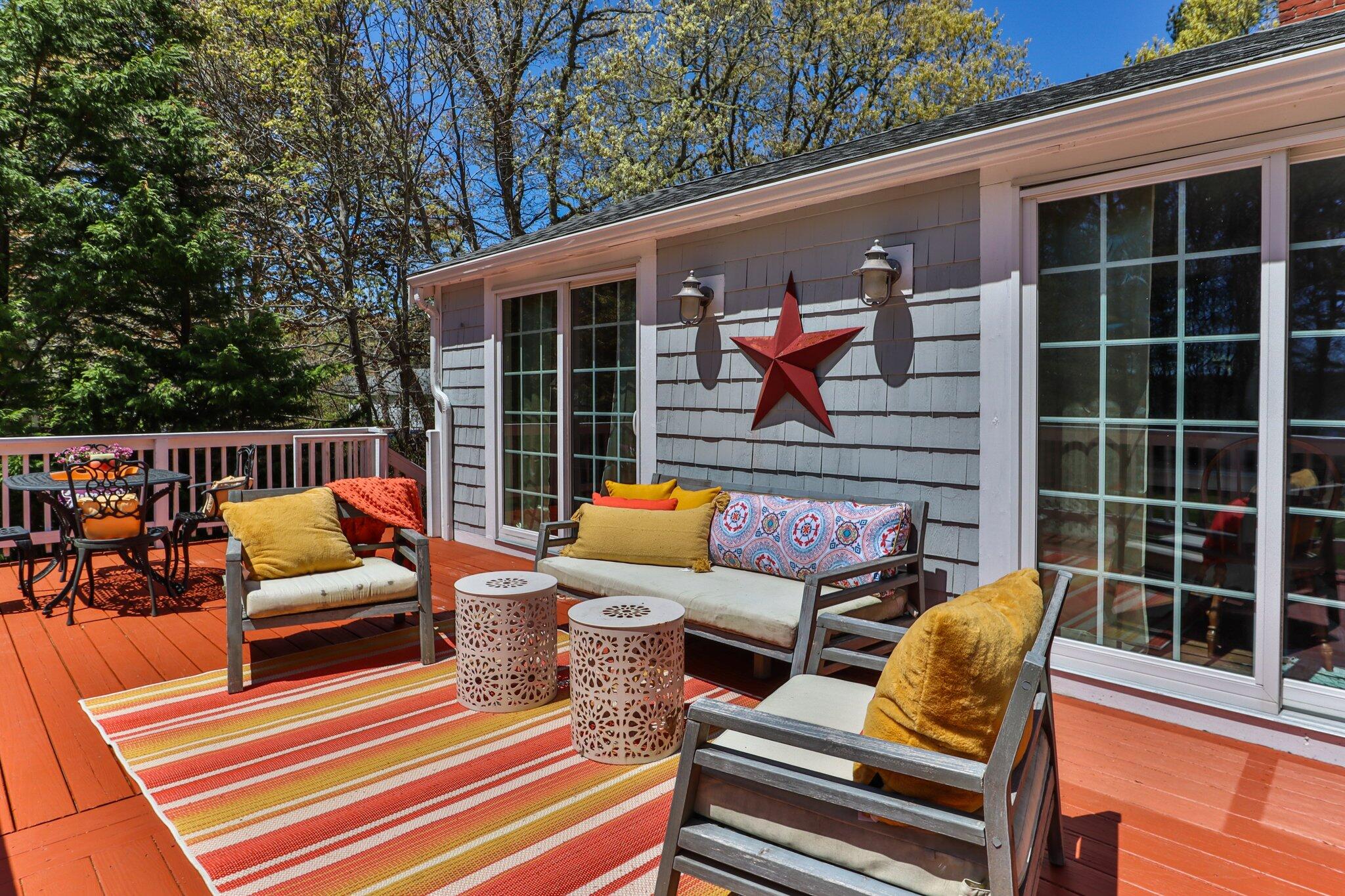 28 Swan Lake Road West Yarmouth, MA 02673 - Photo 29 of 44 a view of outdoor sitting area with furniture and wooden deck