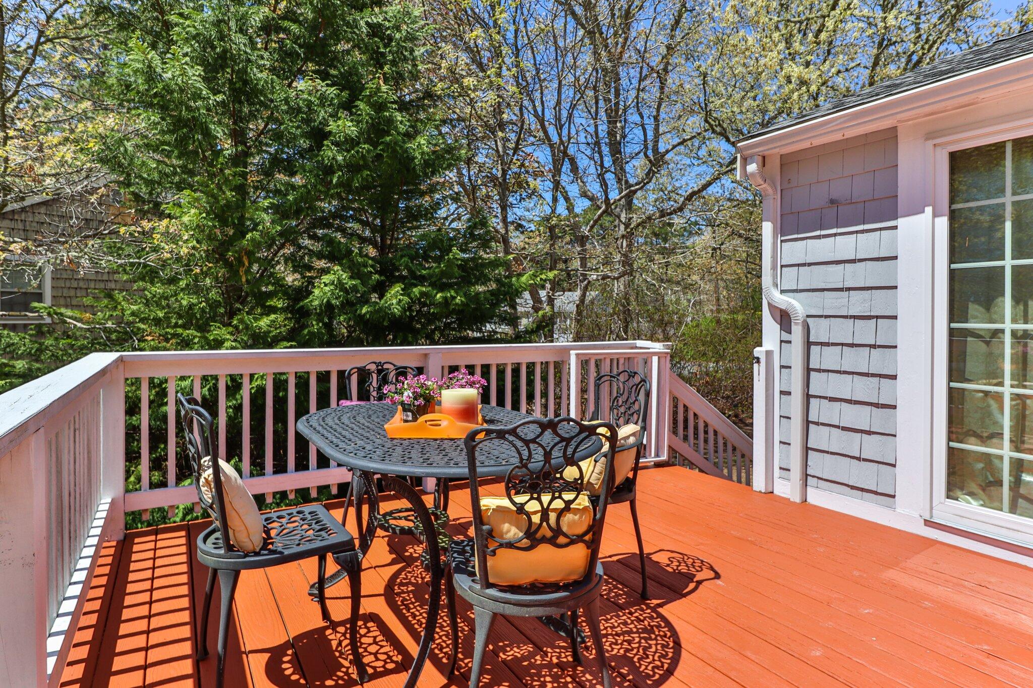 28 Swan Lake Road West Yarmouth, MA 02673 - Photo 30 of 44 a view of balcony with furniture and wooden fence