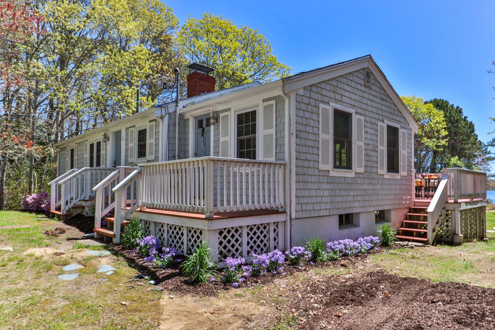 28 Swan Lake Road West Yarmouth, MA 02673 - Photo 3 of 44 a view of a house with a yard