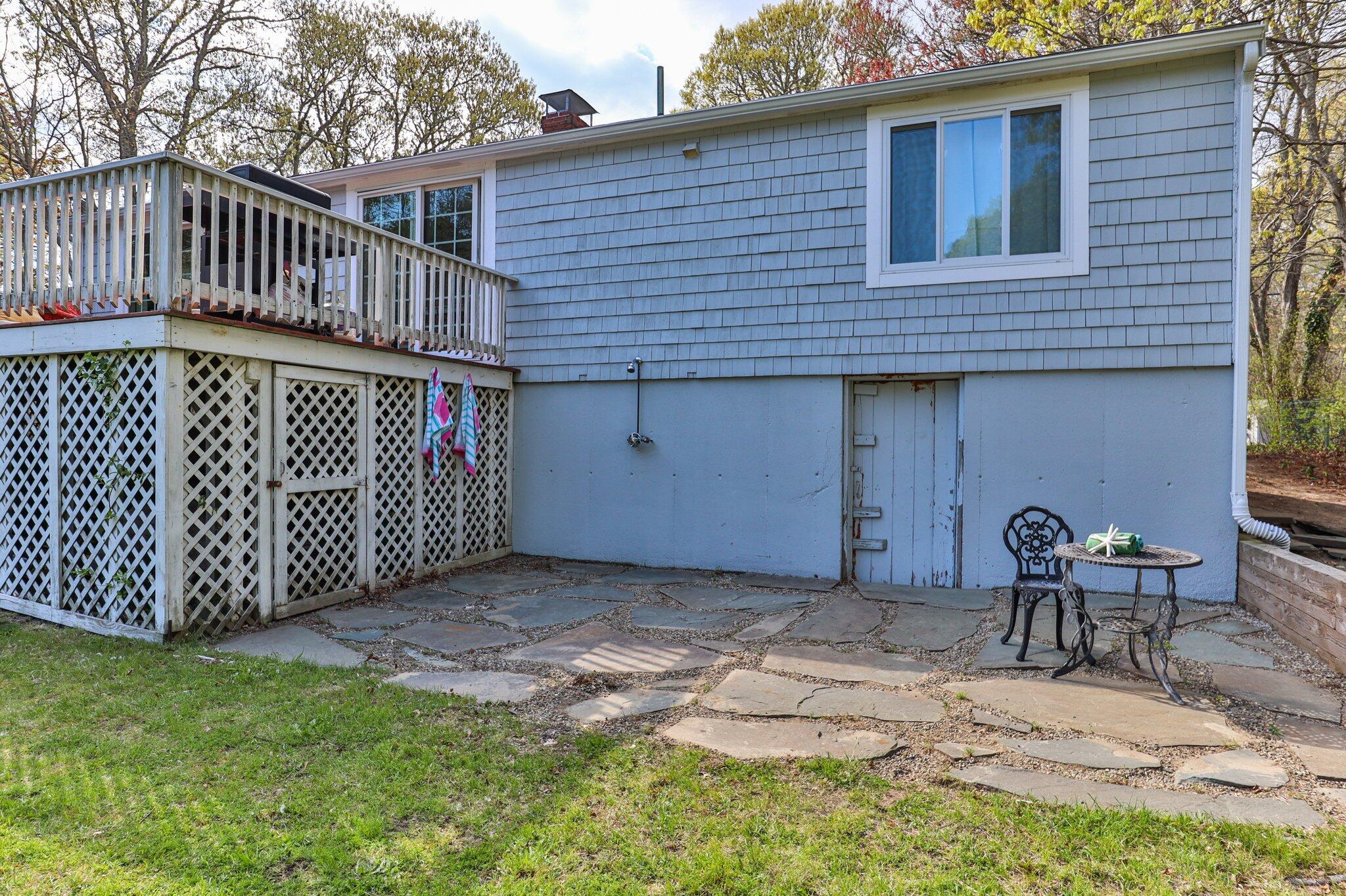 28 Swan Lake Road West Yarmouth, MA 02673 - Photo 40 of 44 a view of a house with backyard and sitting area