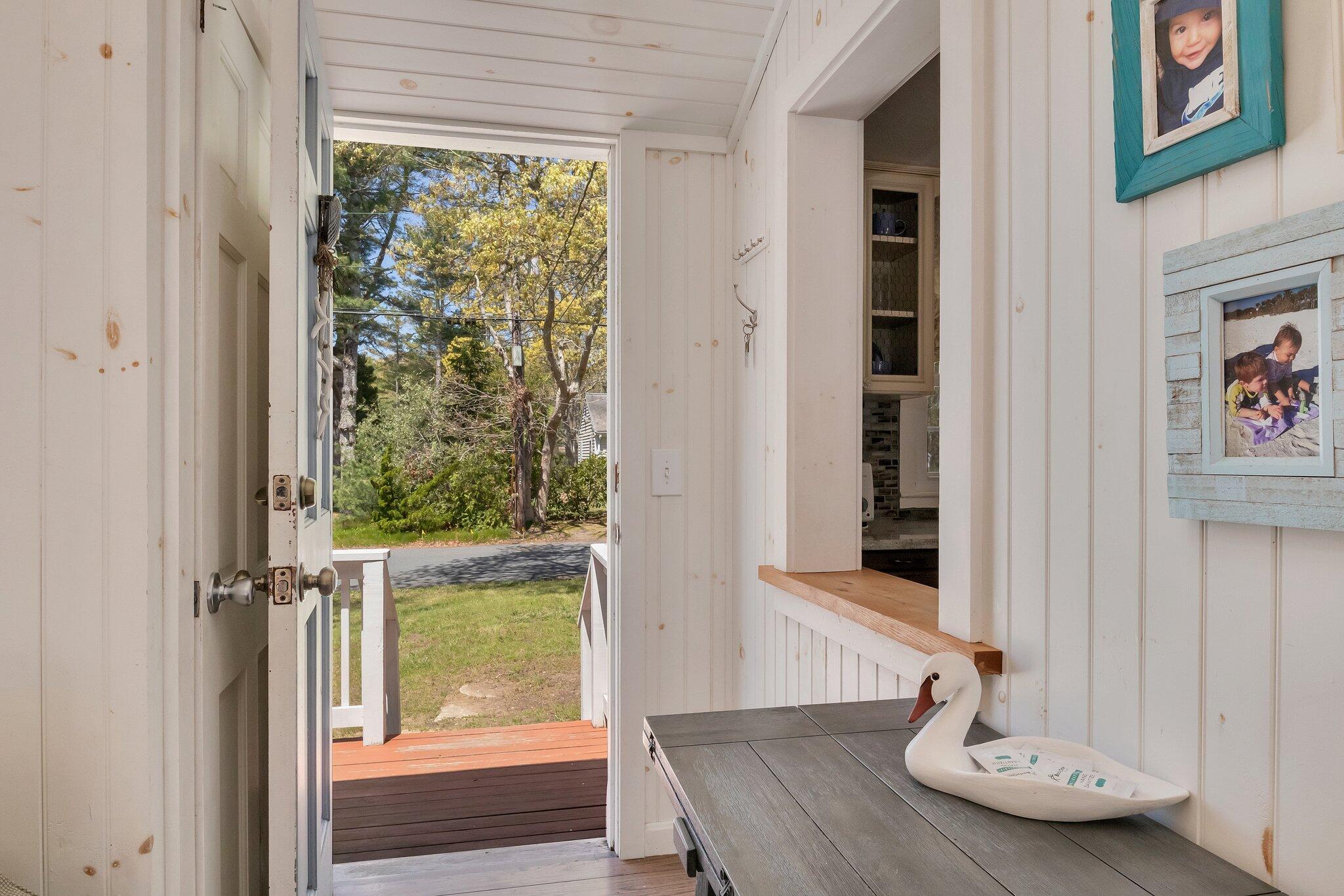 28 Swan Lake Road West Yarmouth, MA 02673 - Photo 4 of 44 a view of a dining room with a table and chairs