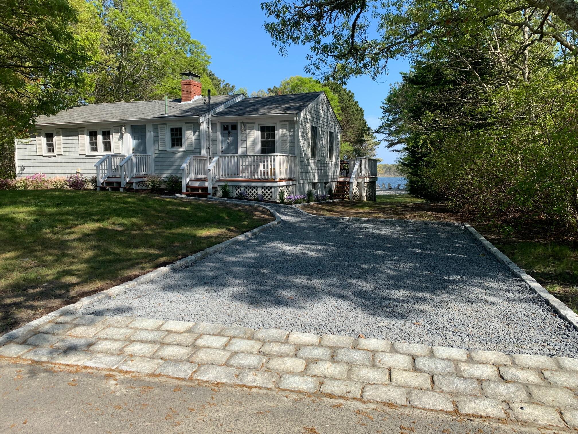 28 Swan Lake Road West Yarmouth, MA 02673 - Photo 44 of 44 a front view of a house with garden