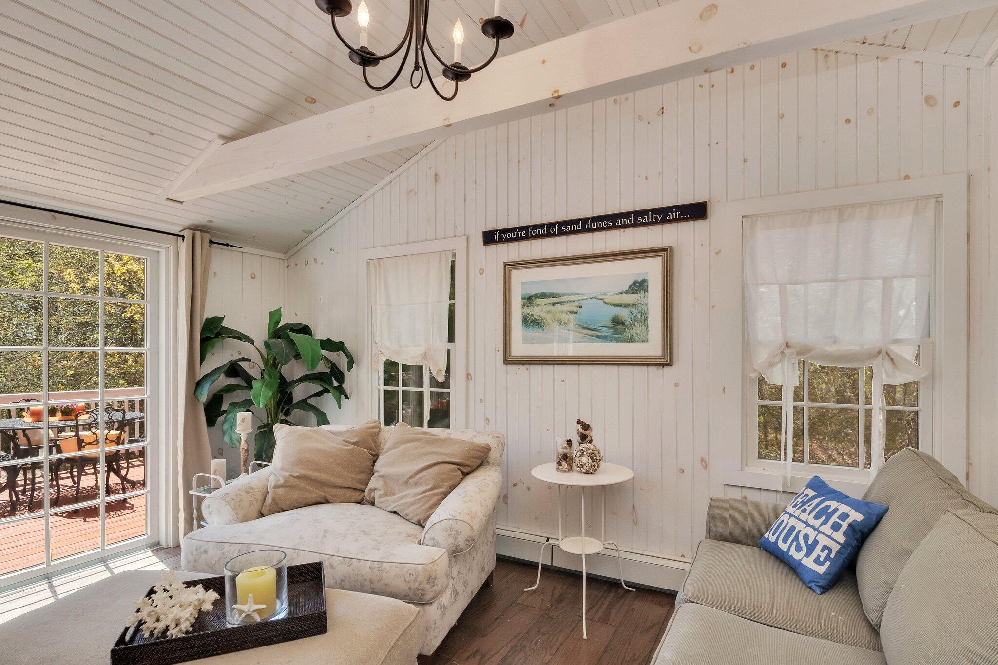 28 Swan Lake Road West Yarmouth, MA 02673 - Photo 8 of 44 a living room with furniture and a large window