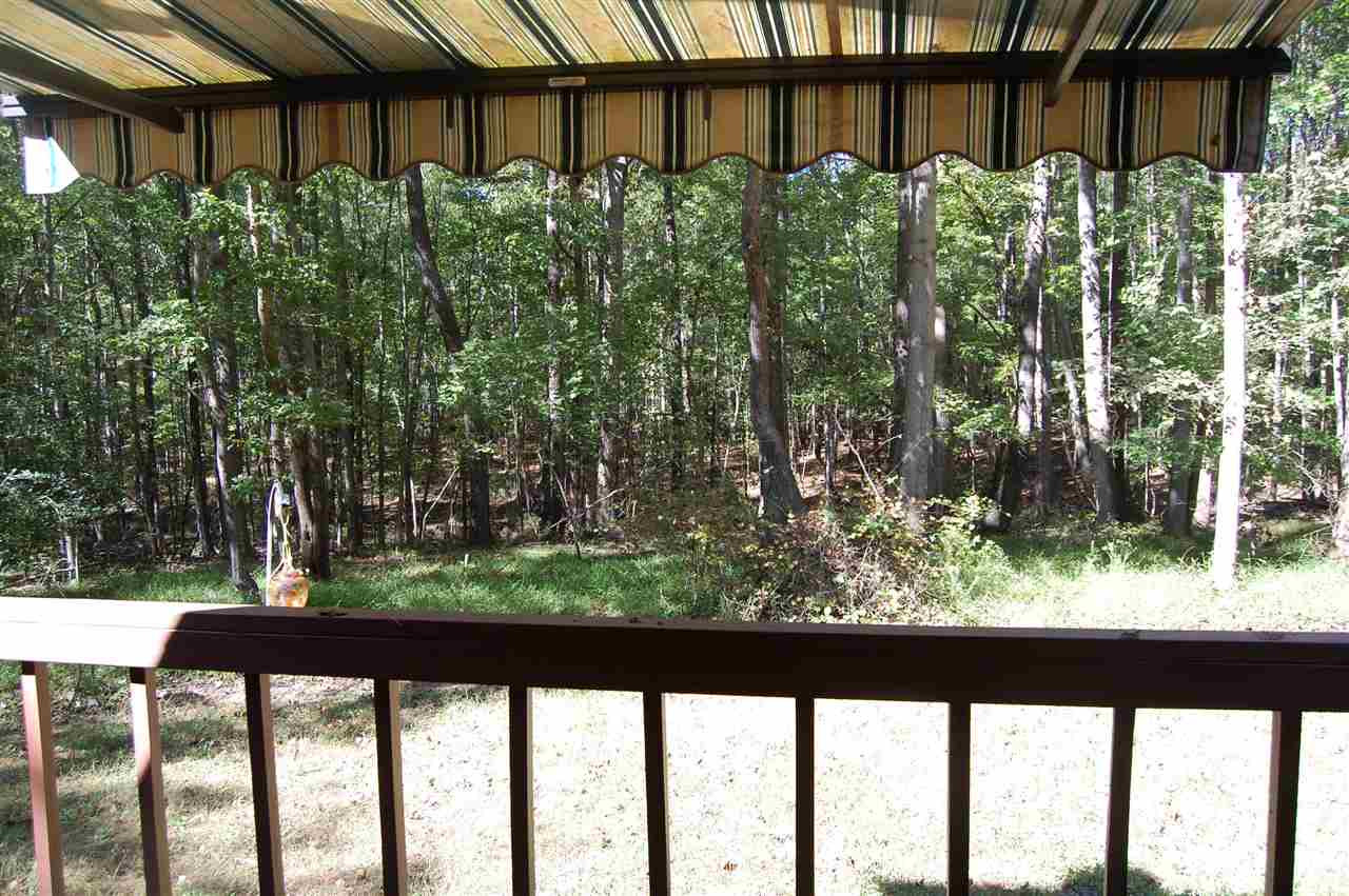 1121 Batchelor Road Apex, NC 27523 - Photo 19 of 30 View of the side deck (17.2x11.9) off the Utility room back door w/the electric awning fully extended to cover this deck! (there are 2) These covered decks are wonderfully private spaces! Side Deck 2