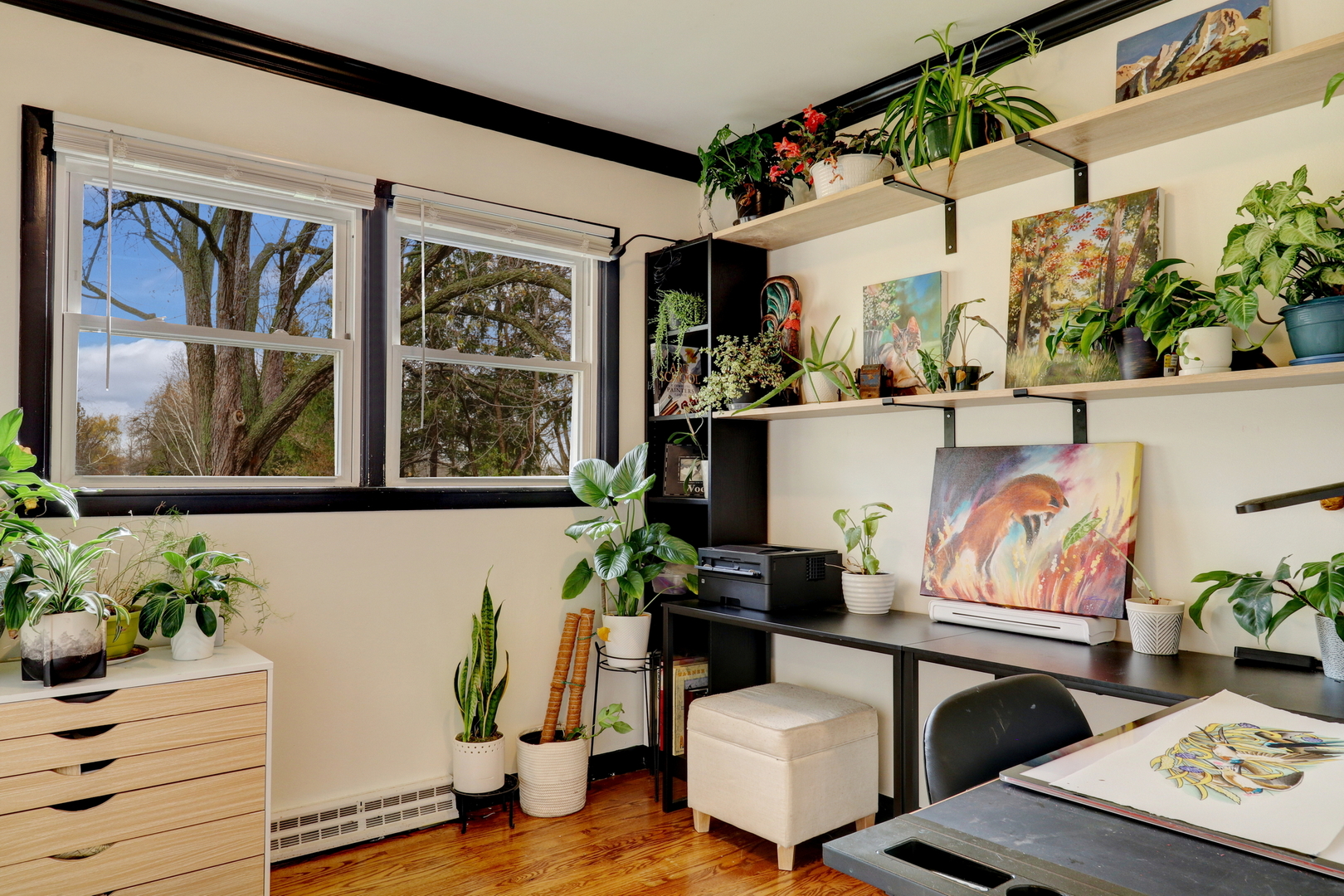 358 Rye Road Mundelein, IL 60060 - Photo 16 of 38 a room with painting on the wall and a potted plant