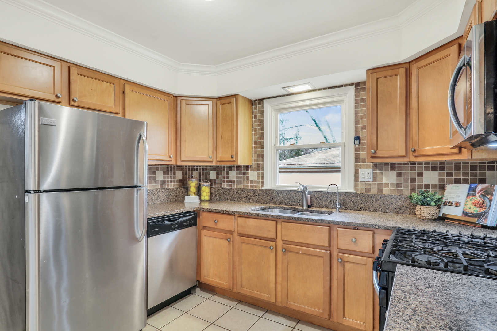 358 Rye Road Mundelein, IL 60060 - Photo 9 of 38 a kitchen with a refrigerator a sink cabinets and wooden floor