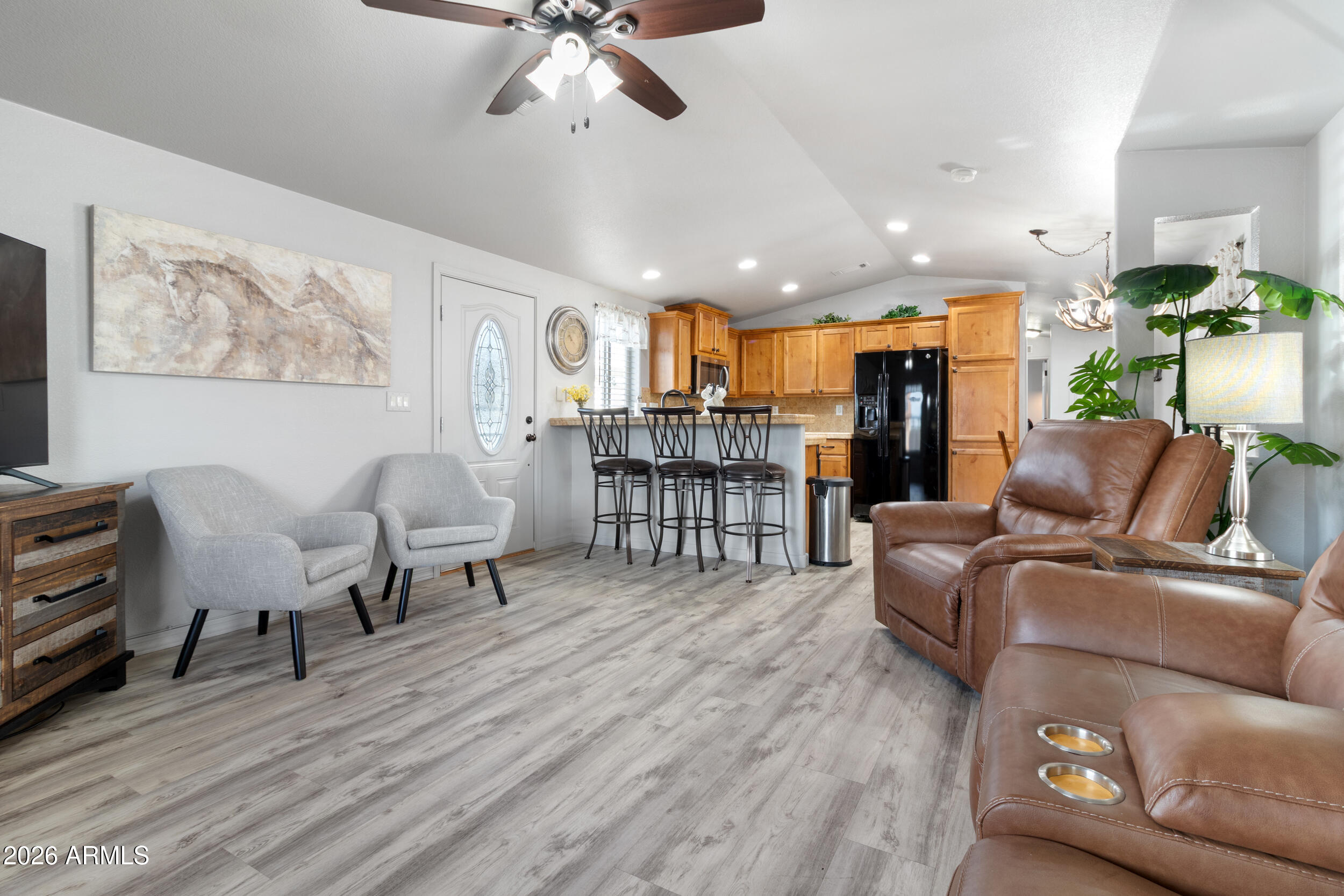 10936 East Apache Trail, Unit 121 Apache Junction, AZ 85120 - Photo 6 of 10 a living room with furniture and kitchen view