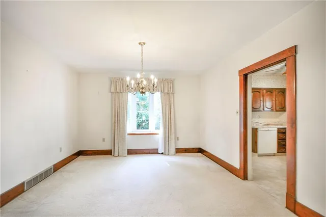 a view of a room with windows and chandelier
