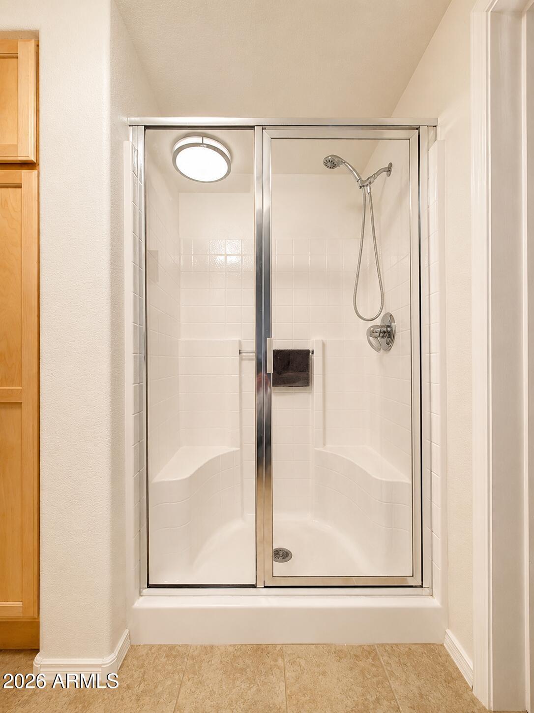 2150 West Alameda Road, Unit 1020 Phoenix, AZ 85085 - Photo 26 of 35 a bathroom with a glass shower door