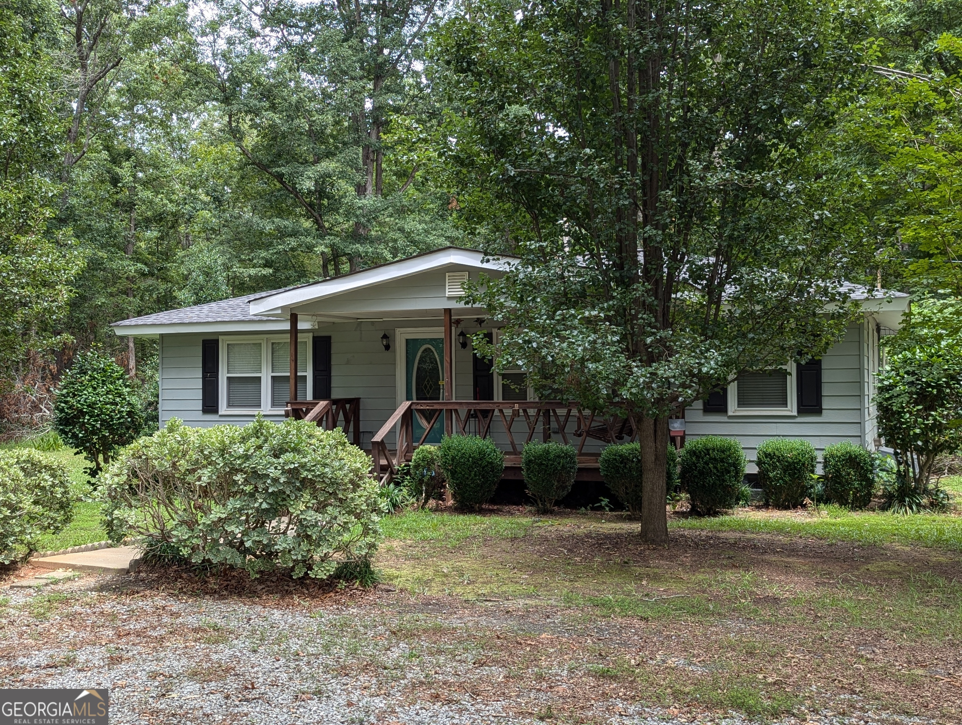 303 Cook Road Griffin, GA 30224 - Photo 1 of 1 a view of a house with a yard and large trees
