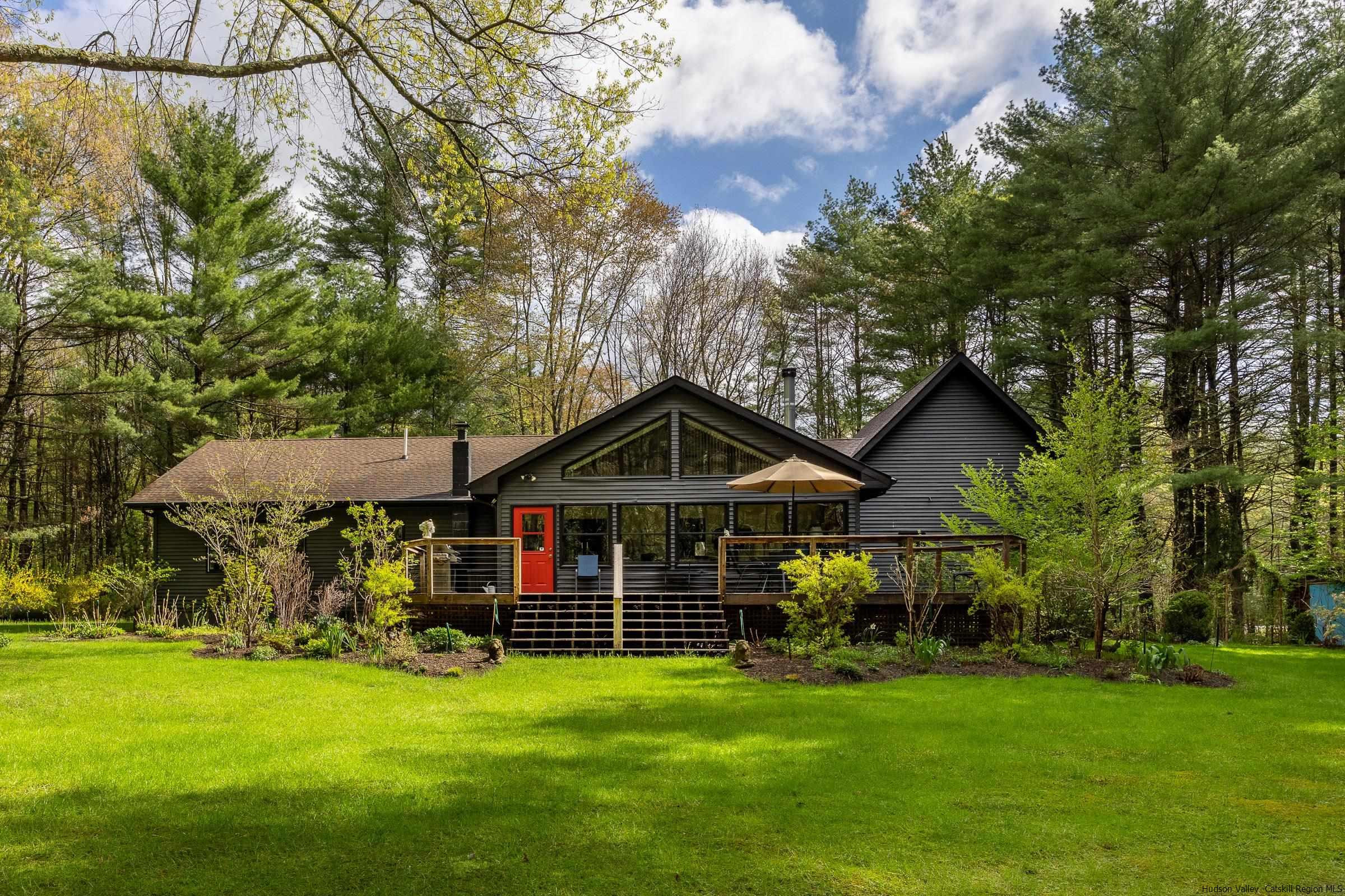279 Scarawan Road Stone Ridge, NY 12484 - Photo 1 of 23 a view of a big house with a big yard and large trees