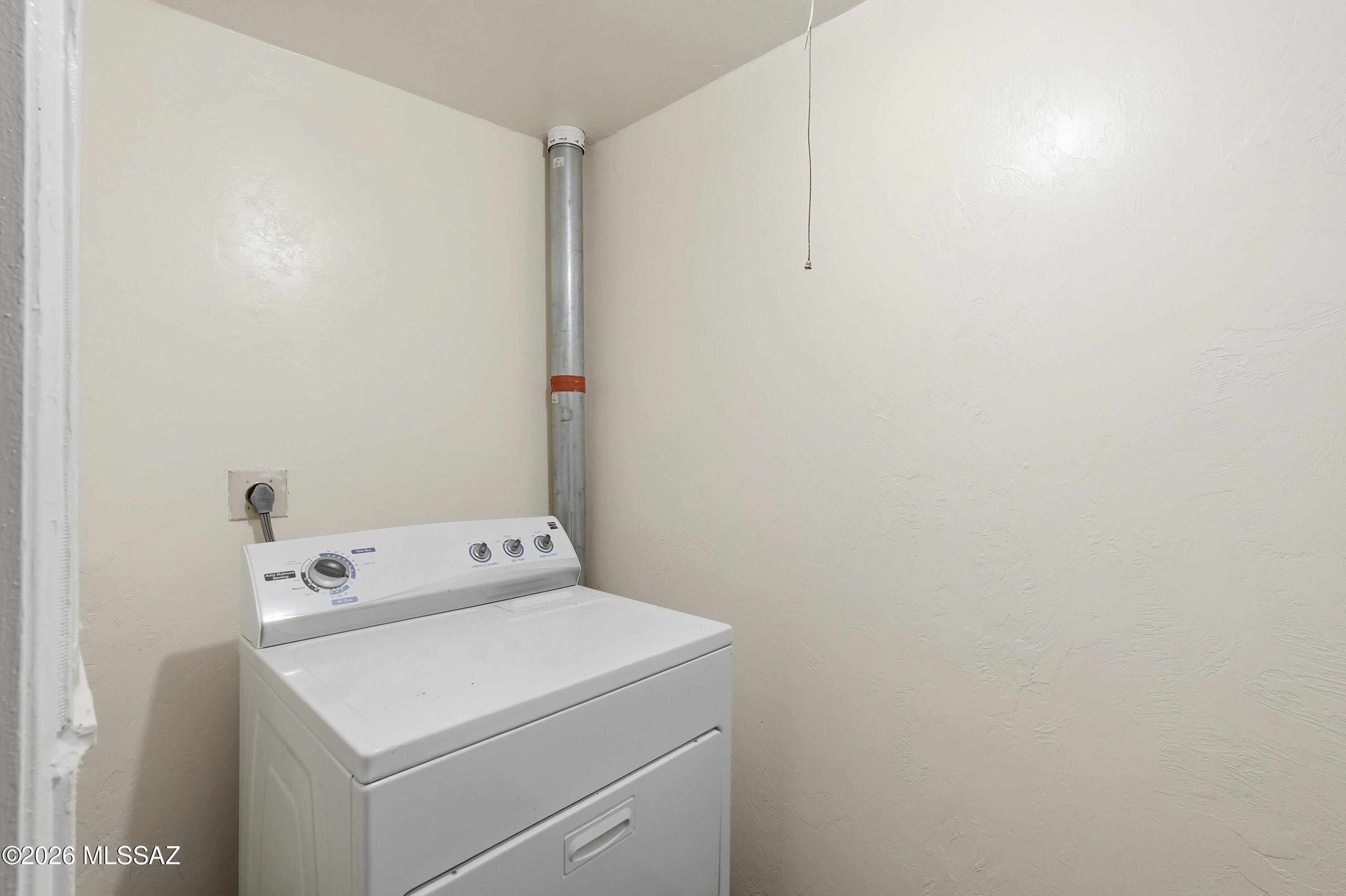 1808 West Caravelle Road Tucson, AZ 85713 - Photo 31 of 38 a utility room with dryer and washer