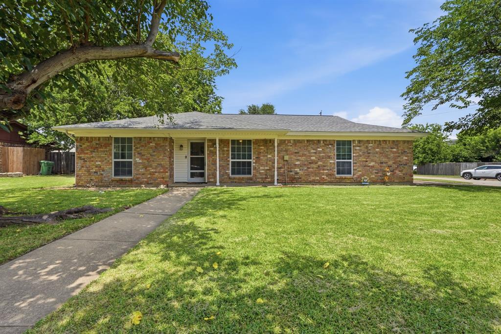 837 Springdale Road Bedford, TX 76021 - Photo 2 of 28 Brick exterior with a covered front porch and a gabled roof