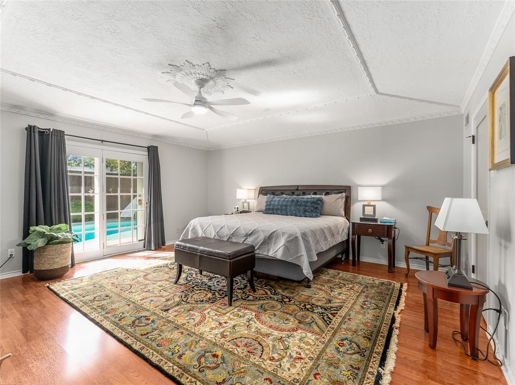 4446 Thunder Road Dallas, TX 75244 - Photo 22 of 39 Bedroom with access to outside, a textured ceiling, light wood-type flooring, and ceiling fan