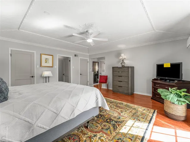 a bed room with a bed and a television