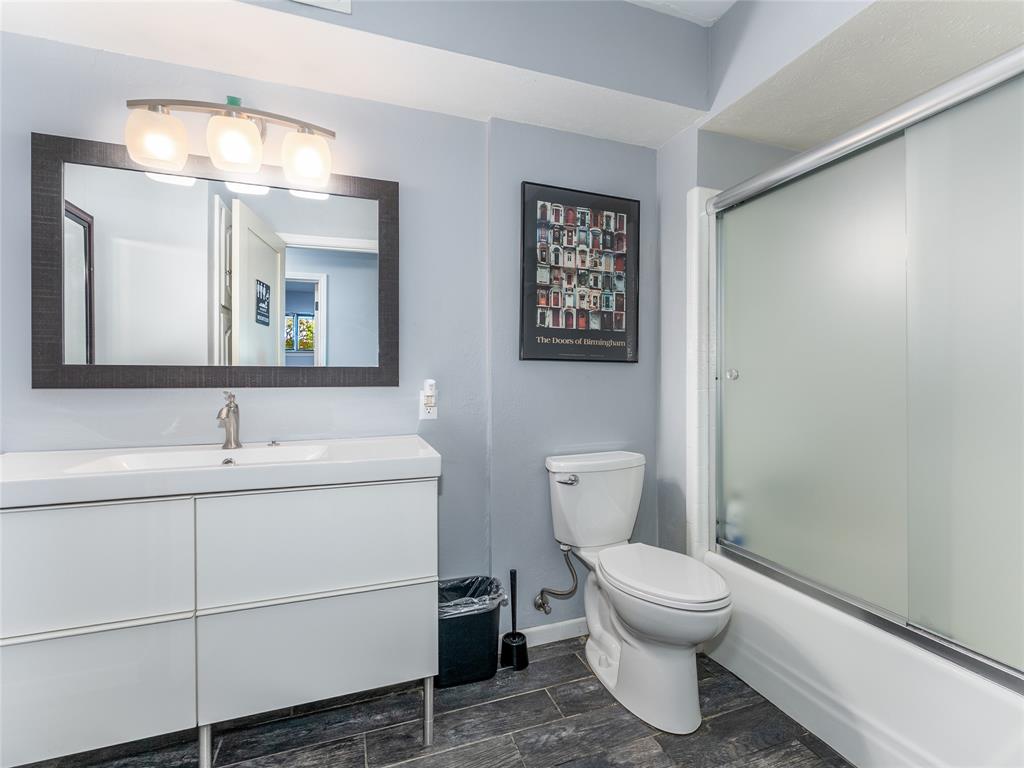 4446 Thunder Road Dallas, TX 75244 - Photo 28 of 39 Full bathroom featuring vanity and bath / shower combo with glass door