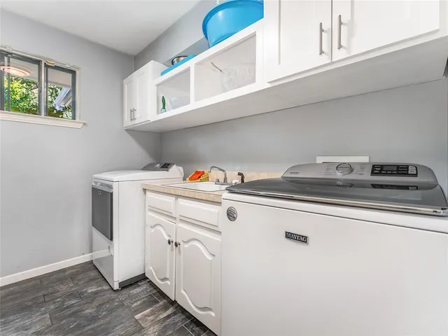 a utility room with dryer and washer