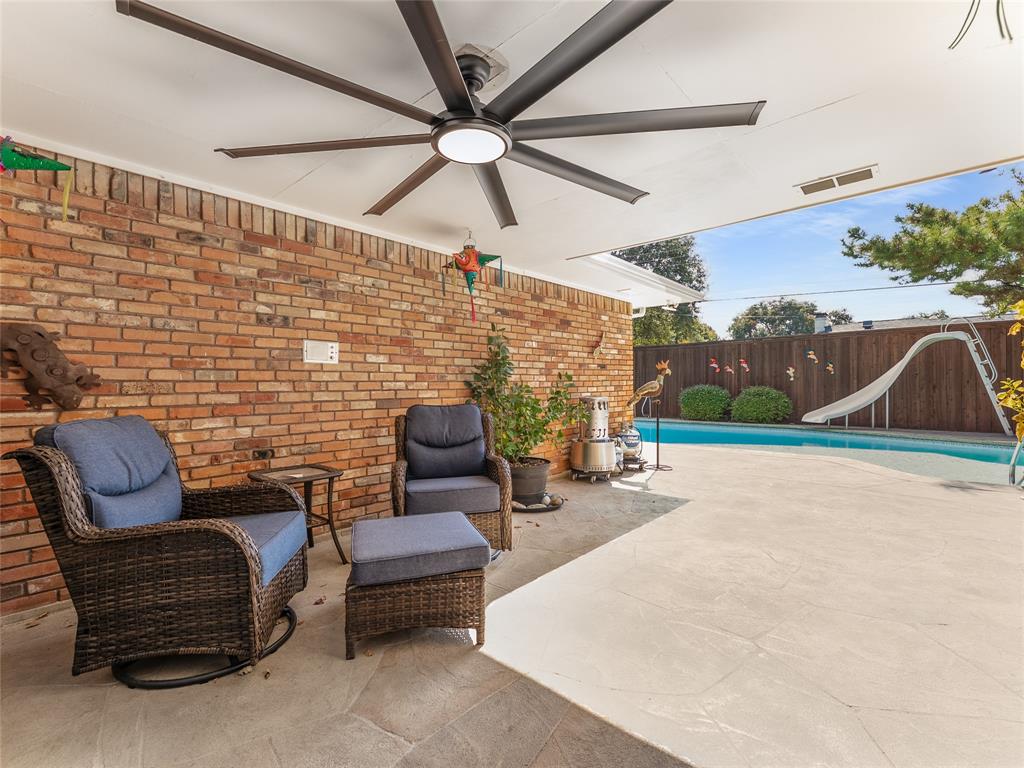 4446 Thunder Road Dallas, TX 75244 - Photo 31 of 39 Fenced backyard featuring a patio area and ceiling fan