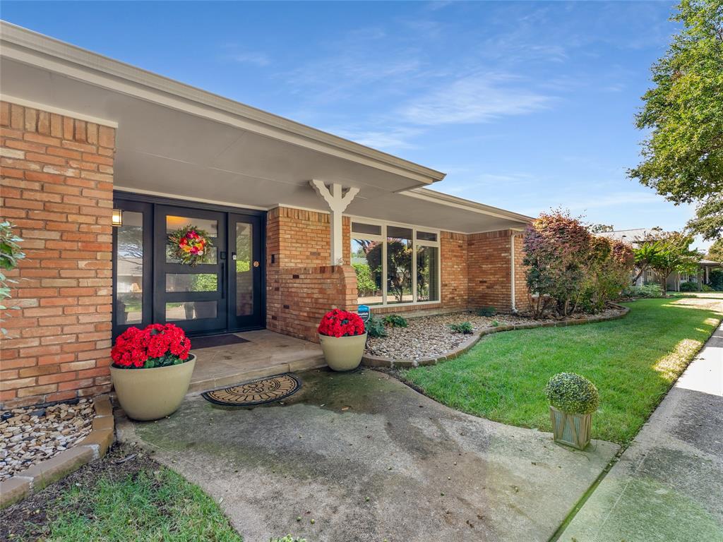 4446 Thunder Road Dallas, TX 75244 - Photo 4 of 39 Single story home with front view of front door