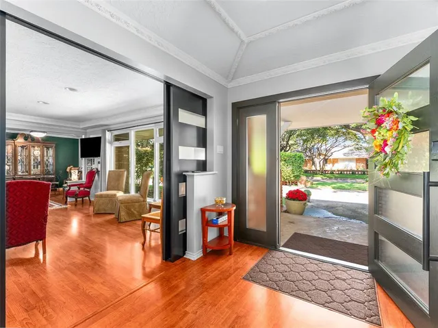 a living room with furniture and garden view