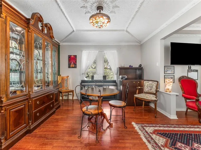 a view of a livingroom with furniture a flat screen tv