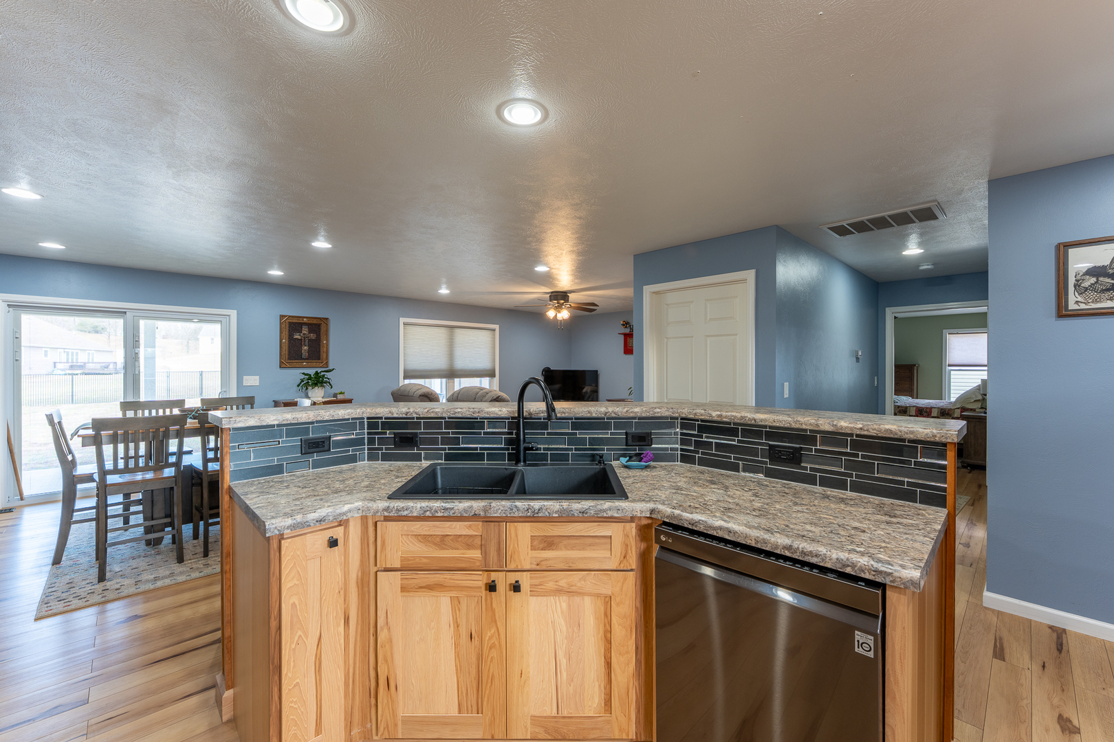 125 Old Bloomfield Road Vienna, IL 62995 - Photo 19 of 53 a kitchen with a stove a sink a microwave a dining table and chairs