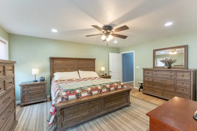 a bed room with a bed and a dresser