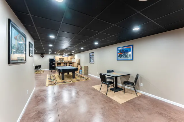 a kitchen with a table and chairs in it