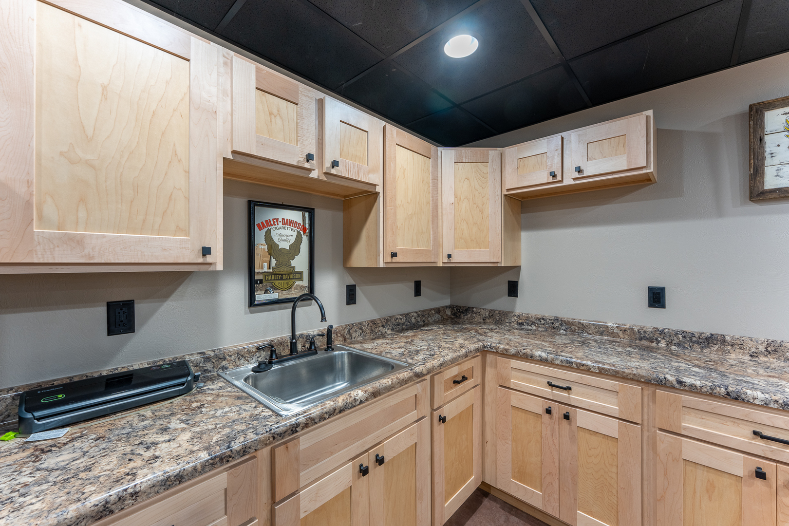 125 Old Bloomfield Road Vienna, IL 62995 - Photo 40 of 53 a kitchen with granite countertop a sink stainless steel appliances and cabinets